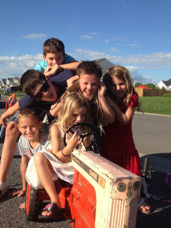 Kids with Cousins and 50 year old tractor