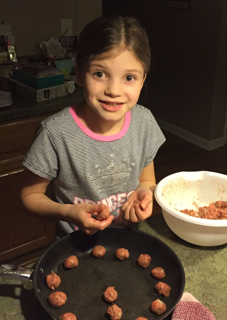 Elizabeth making meatballs
