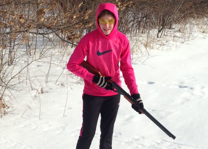 Sydni learning how to handle a rifle