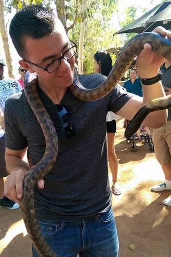 Patrick with snake in Australia